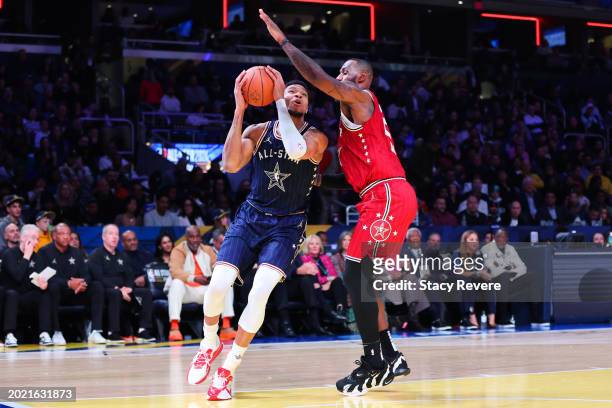 Giannis Antetokounmpo of the Milwaukee Bucks and Eastern Conference All-Stars drives against LeBron James of the Los Angeles Lakers and Western...