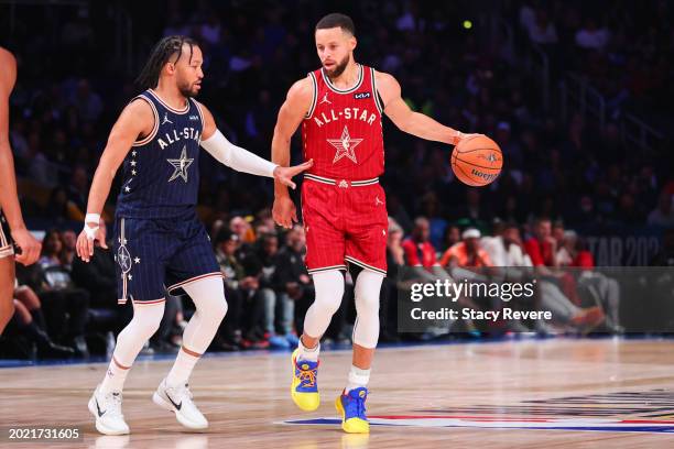 Stephen Curry of the Golden State Warriors and Western Conference All-Stars dribbles the ball against Jalen Brunson of the New York Knicks and...