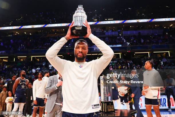 Damian Lillard of the Milwaukee Bucks poses for a photo with the Kobe Bryant All-Star MVP trophy during the 2024 NBA All-Star Game at Gainbridge...