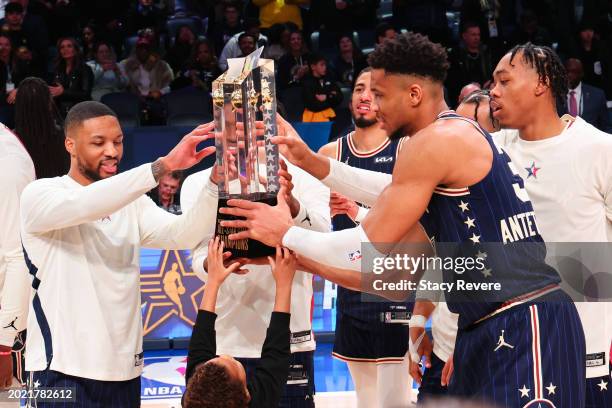 Damian Lillard of the Milwaukee Bucks and Eastern Conference All-Stars and Giannis Antetokounmpo of the Milwaukee Bucks and Eastern Conference...