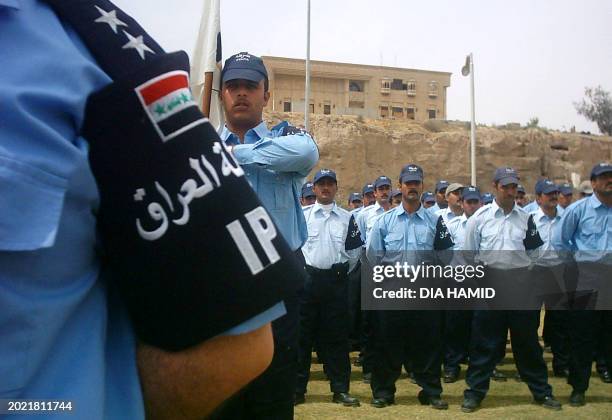 Iraqi police attend their graduation ceremony at a former palace belonging to ousted president Saddam Hussein 17 May 2005, in the northern city of...