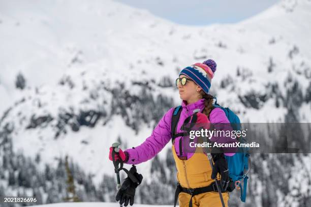 backcountry skier climbing mountain - nordic skiing stock pictures, royalty-free photos & images