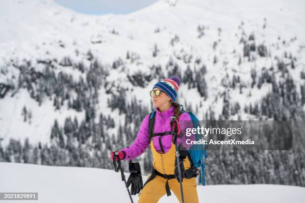 backcountry skier climbing mountain - nordic skiing stock pictures, royalty-free photos & images