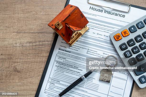 money, pile coin with saving book and paper home,concept - wohngebäudeversicherung stock-fotos und bilder