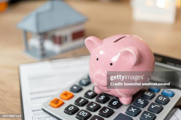 home and money for your good real estate - piggy bank stock pictures, royalty-free photos & images