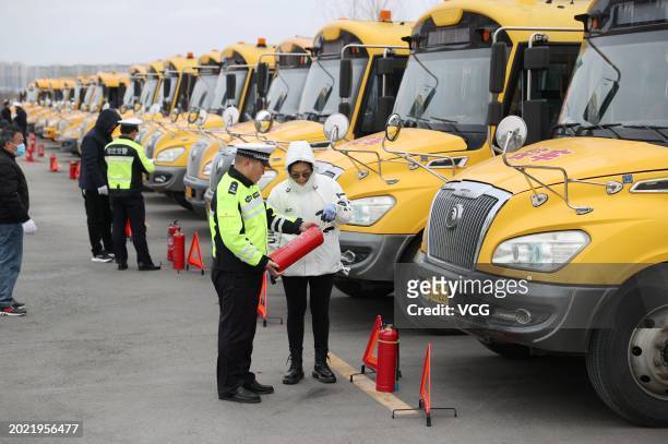 Policemen check school buses on February 19, 2024 in Suqian, Jiangsu Province of China. Safety checks for school buses were started in many places of...