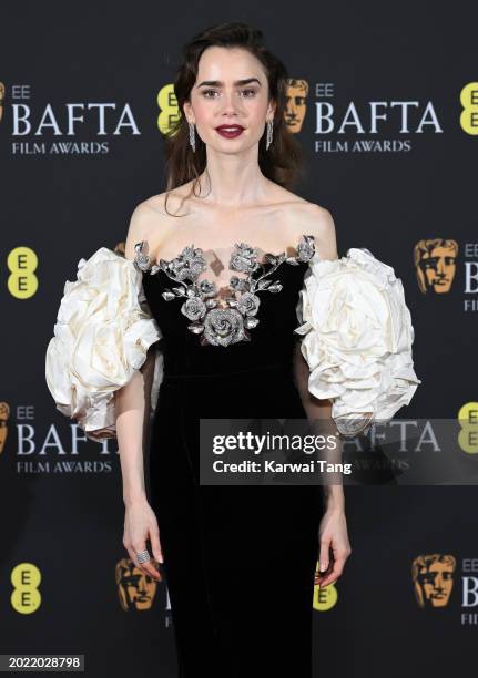 Lily Collins poses in the Winners Room during the EE BAFTA Film Awards at The Royal Festival Hall on February 18, 2024 in London, England.