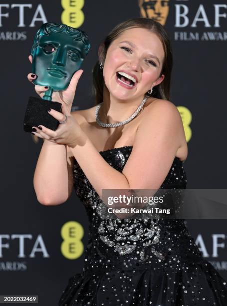 Mia Mckenna-Bruce poses with the EE Rising Star Award in the Winners Room during the EE BAFTA Film Awards at The Royal Festival Hall on February 18,...