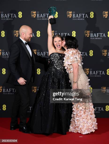 Wayne Mckenna- Bruce, Mia Mckenna-Bruce and Angela Mckenna-Bruce pose in the Winners Room during the EE BAFTA Film Awards at The Royal Festival Hall...