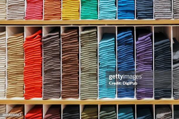 organized display of colorful socks in store - sock shop international stock pictures, royalty-free photos & images