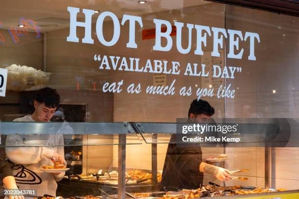 Eat as much as you like hot buffet at a Chinese restaurant in Chinatown on 5th February 2024 in London, United Kingdom. Many people eat bargain food...