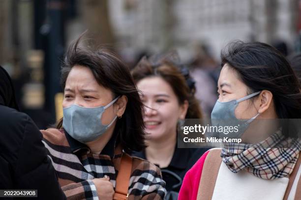 People wearing face masks to protect against Coronavirus / Covid-19 on 5th February 2024 in London, United Kingdom. The usage of face coverings in...