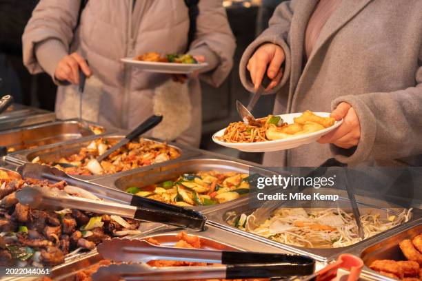 Eat as much as you like hot buffet at a Chinese restaurant in Chinatown on 5th February 2024 in London, United Kingdom. Many people eat bargain food...