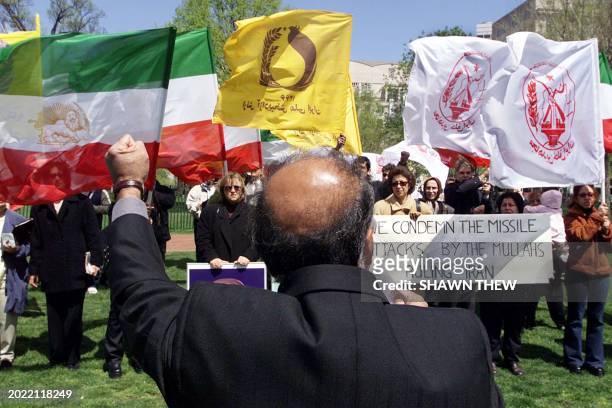 Asghar Abbaszadeh, a supporter of the National Council of Resistance of Iran, speaks to the crowd condemning the 18 April 2001 missile attack on...