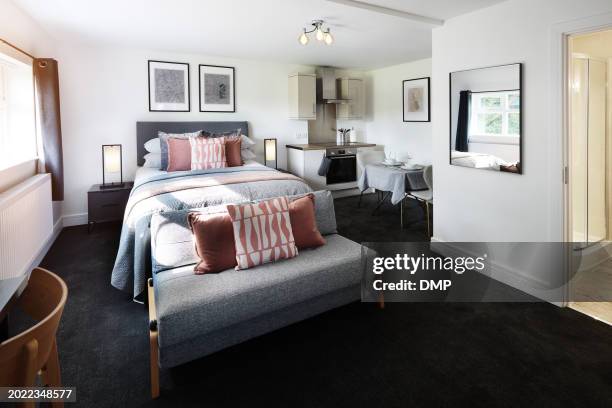 hotel, interior and room at luxury accommodation for travel, vacation or holiday in england. hospitality, bedroom and empty elegant suite with classy furniture and decor for weekend trip at lodge. - motel stock pictures, royalty-free photos & images