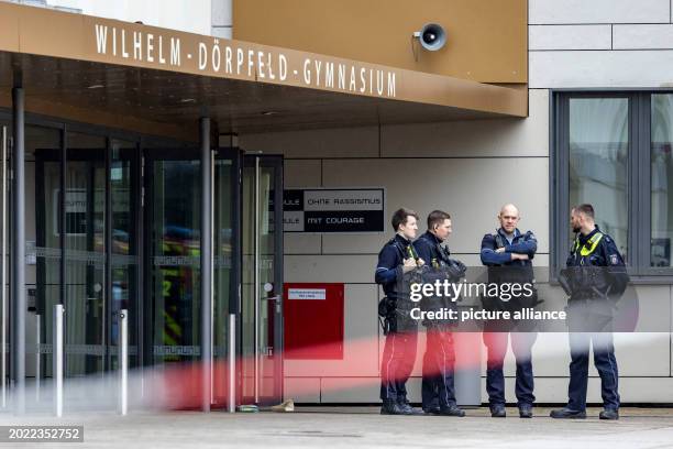 February 2024, North Rhine-Westphalia, Wuppertal: Police officers stand in front of the Wilhelm-Dörpfeld-Gymnasium. Several pupils have been injured...