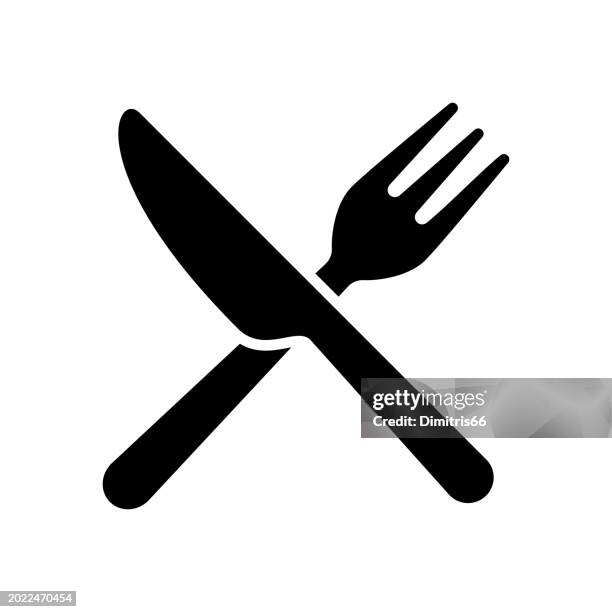 crossed fork and knife icon - table knife stock illustrations