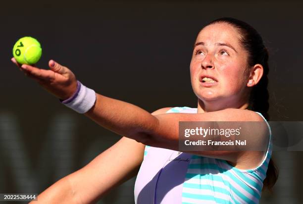 Jelena Ostapenko of Latvia serves against Xiyu Wang of Chinain their first round women's singles match during the Dubai Duty Free Tennis...