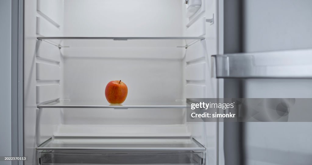 Close-up of red apple in fridge