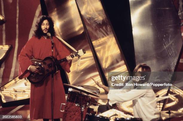 From left, guitarist Peter Green and drummer Mick Fleetwood perform with British rock and blues group Fleetwood Mac on the set of a pop music...