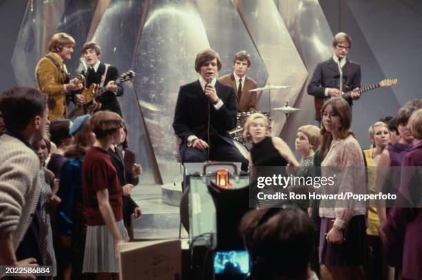 English pop group Herman's Hermits perform on the set of a pop music television show in London circa 1968. Members of the band are, from left,...