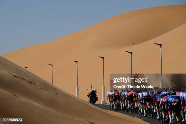 General view of the peloton passing through a landscape in the desert during the 6th UAE Tour 2024, Stage 1 a 141km stage from Al Dhafra Walk Madinat...