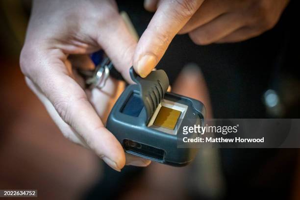 In this photo illustration, A close-up of a home office fingerprint scanner on January 22, 2024 in Cardiff, Wales.