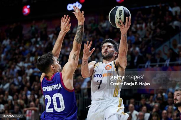 Facu Campazzo of Real Madrid and Nico Laprovittola of FC Barcelona in action during the Finals of the 2024 Copa del Rey de Baloncesto match between...