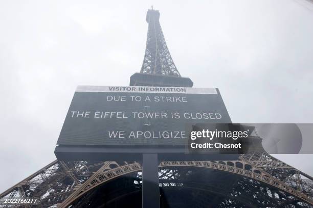 An information panel announces the closure of the Eiffel Tower as employees strike on February 19, 2024 in Paris, France. The Eiffel Tower is closed...