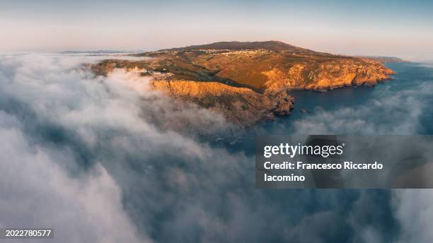 aerial view of cabo da rocha with fog on ocean, portugal - iacomino portugal stock-fotos und bilder