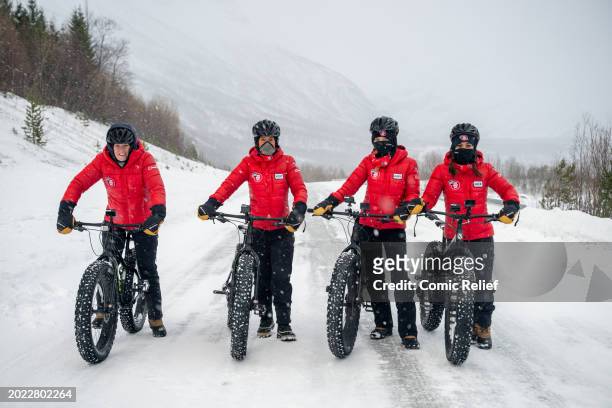 Sara Davies, Vicky Pattison, Laura Whitmore and Alex Scott pose with their fat bikes at the start of the 'Snow Going Back' challenge through the...
