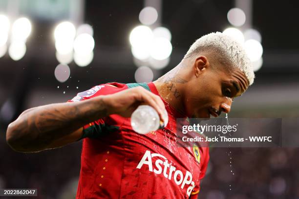 Mario Lemina of Wolverhampton Wanderers splashes water on his face ahead of the Premier League match between Tottenham Hotspur and Wolverhampton...