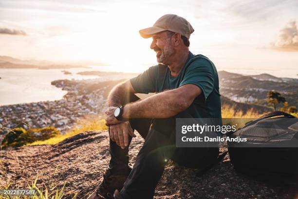 active senior hiker enjoying the view - male backpacker stock pictures, royalty-free photos & images