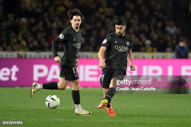 Marco Asensio, left Vitinha of PSG in action during the Ligue 1 Uber Eats match between FC Nantes and Paris Saint-Germain at Stade de la Beaujoire on...