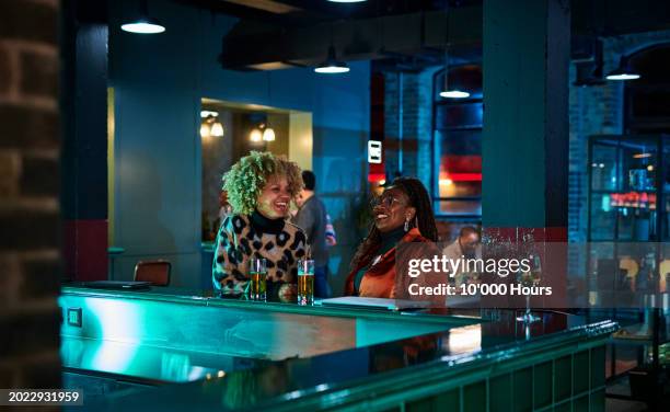 friends enjoying after work drinks - bar stock pictures, royalty-free photos & images