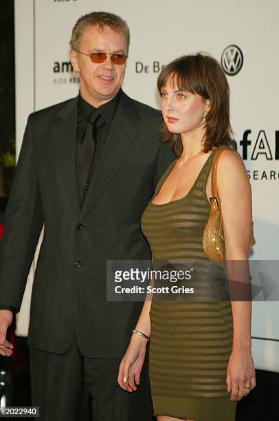Actor Tim Robbins and Eva Maria Livia Amurri attend amfAR's "Cinema Against AIDS" benefit during the 56th International Cannes Film Festival 2003 on...