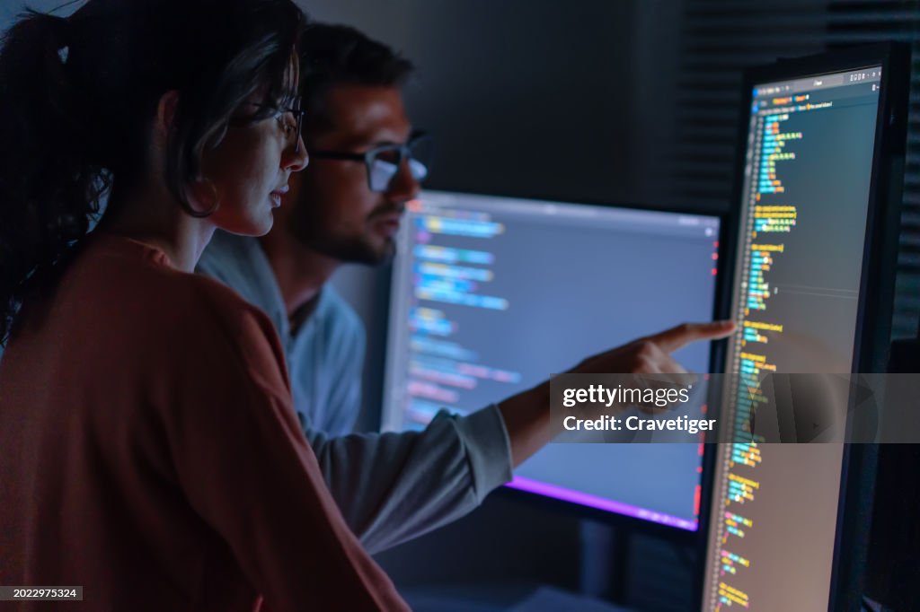 Computer, Female programmer and male training for coding, cyber security or software on computer. Female IT specialist, male coder or talking to connect internet, information update and cloud computing . coding development concept.