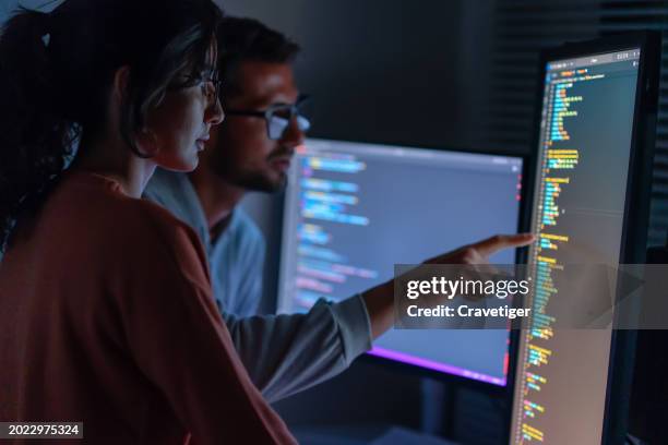 computer, female programmer and male training for coding, cyber security or software on computer. female it specialist, male coder or talking to connect internet, information update and cloud computing . coding development concept. - server stock-fotos und bilder