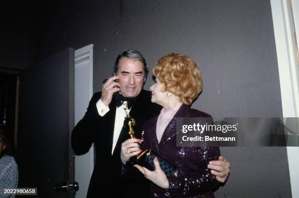 American actor Gregory Peck with comedienne Lucille Ball who was honoured with the Cecil B DeMille Award at the 36th Annual Golden Globe Awards at...