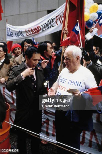 Pro-Taiwan protesters gathered outside the Sheraton Hotel to demonstrate against Chinese Vice Premier Deng Xiaoping's visit to Houston, Texas,...