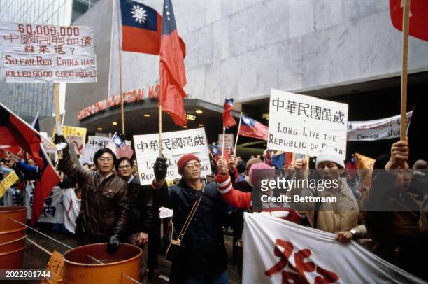 Pro-Taiwan protesters gathered outside the Sheraton Hotel to demonstrate against Chinese Vice Premier Deng Xiaoping's visit to Houston, Texas,...