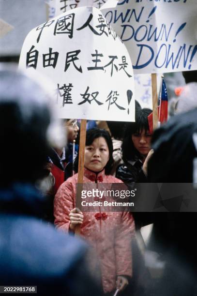 Pro-Taiwan protesters holding placards gather outside the Sheraton Hotel to demonstrate against Chinese Vice Premier Deng Xiaoping's visit to...