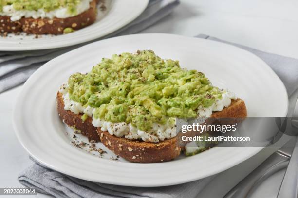 cottage cheese toast with creamy avocado - toasted food stock pictures, royalty-free photos & images