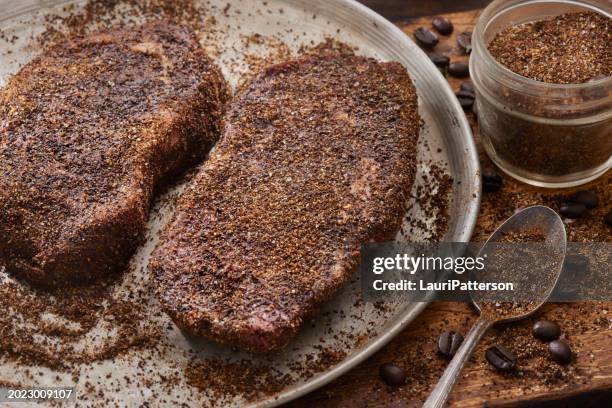 preparing coffee dry rubbed boneless rib eye steaks - bison meat stock pictures, royalty-free photos & images