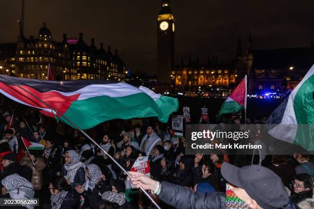 Pro-Palestinian activists protest in Parliament Square on the occasion of a debate and vote inside the House of Commons on a motion by the Scottish...