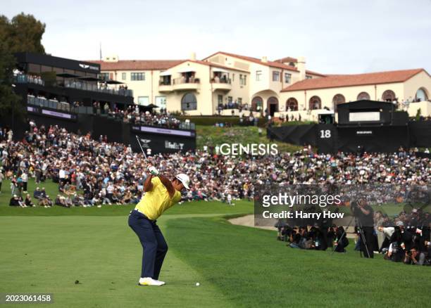 Hideki Matsuyama of Japan hits a second shot on the 18th hole, finishing a round of 62, to win the tournament during the final round of The Genesis...