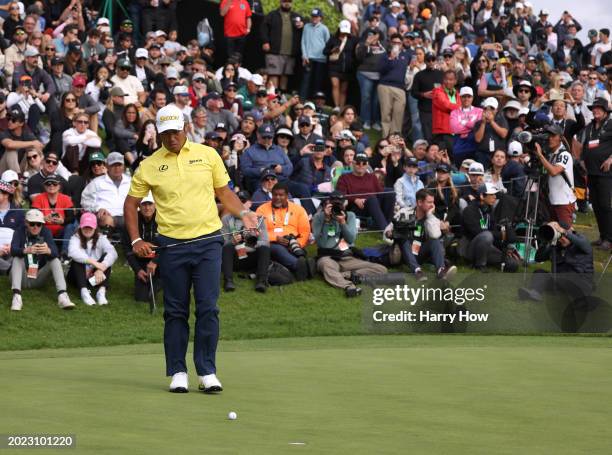 Hideki Matsuyama of Japan lines up his final putt for a finishing a round of 62 on the 18th green, to win the tournament during the final round of...