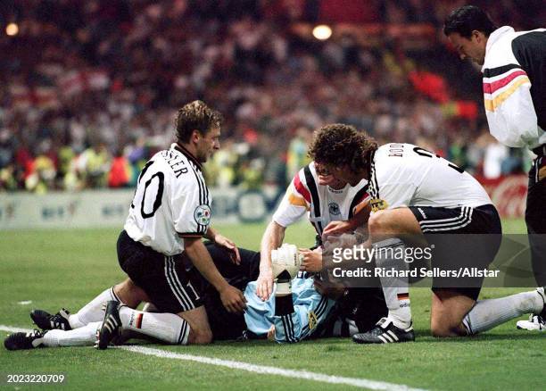 June 26: Andreas Kopke Goalkeeper of Germany celebrates with Thomas Hassler and Marco Bode of Germany when they win the Penalty Shoot out after the...