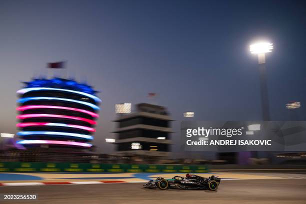 Mercedes' British driver Lewis Hamilton drives during the second day of the Formula One pre-season testing at the Bahrain International Circuit in...