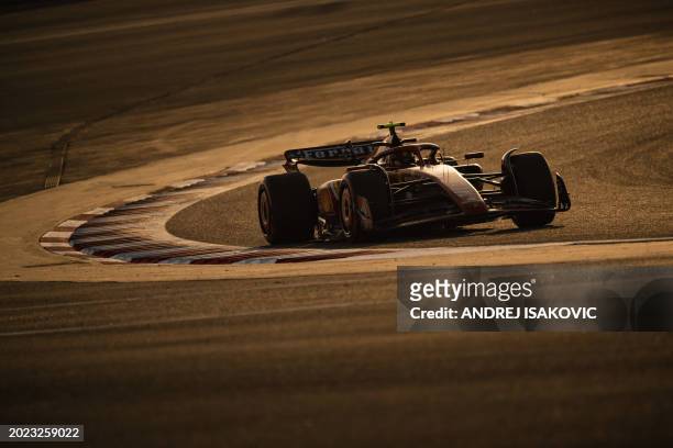 Ferrari's Spanish driver Carlos Sainz Jr drives during the second day of the Formula One pre-season testing at the Bahrain International Circuit in...